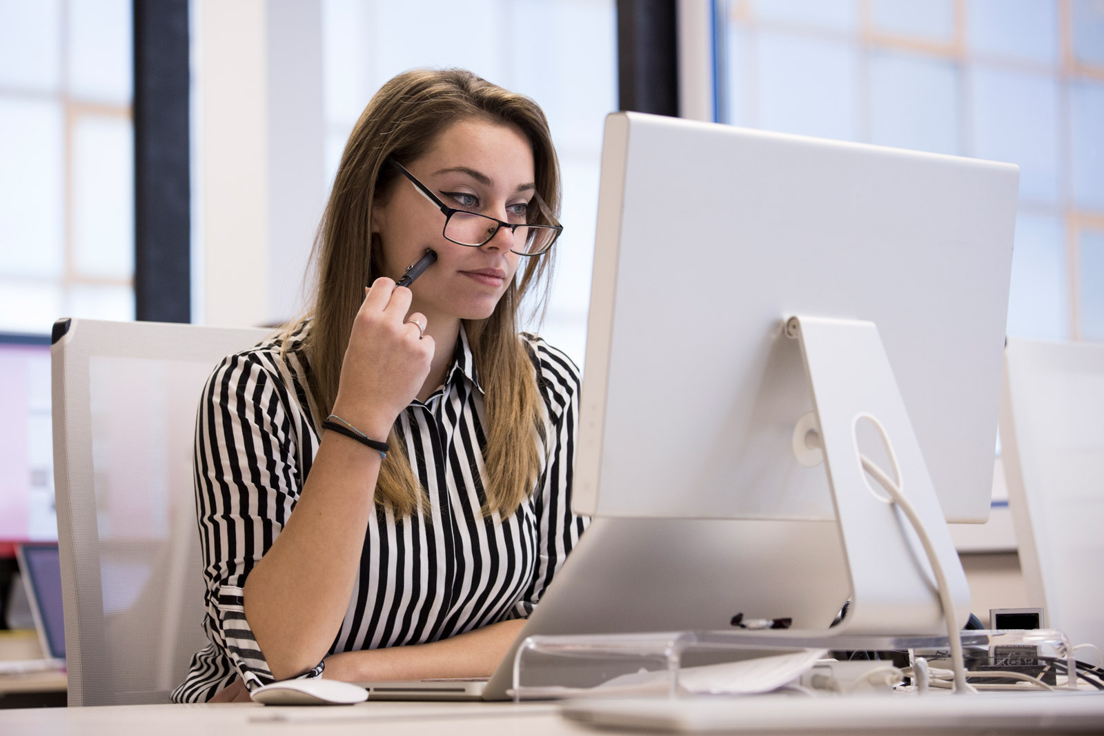 Woman working with desktop computer